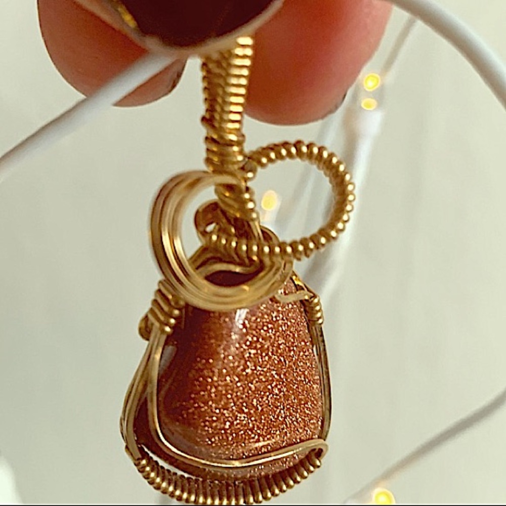 WIRE WRAPPED GOLDSTONE PENDANT